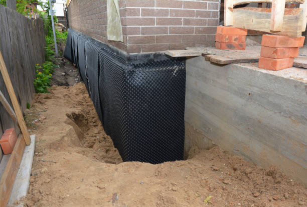 Happy homeowners after waterproofing job in Orleans